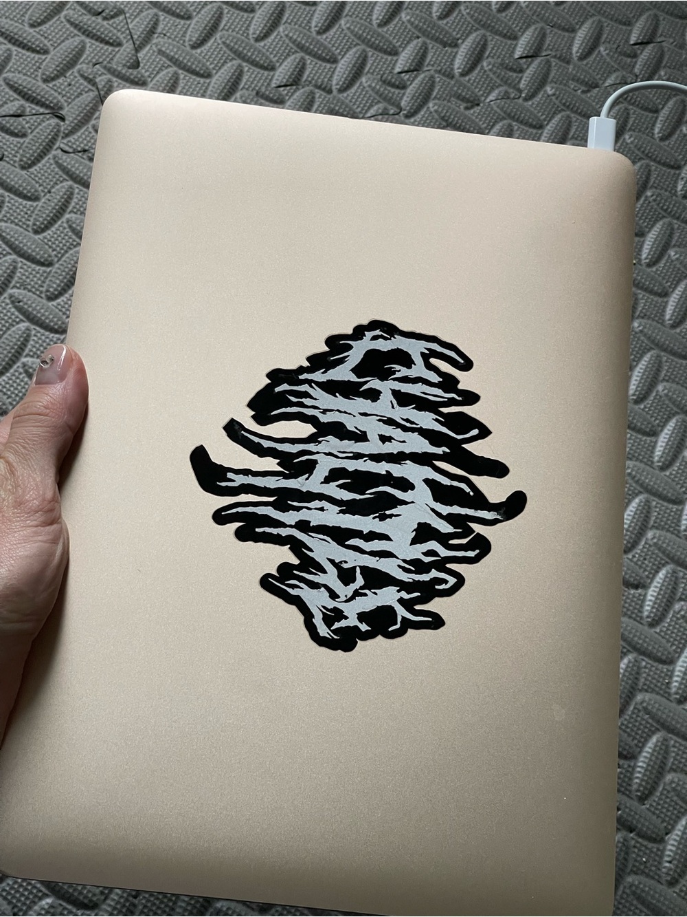 Apple MacBook in Gold with Black Keyboard and Gradient Display